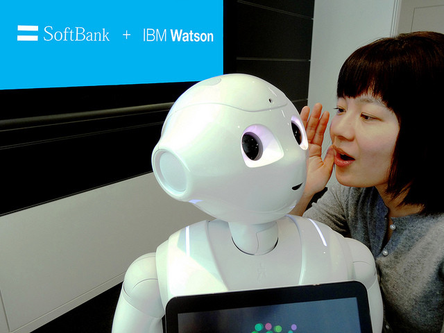 Researcher Risa Nishiyama with Pepper robot using IBM Watson during a demonstration