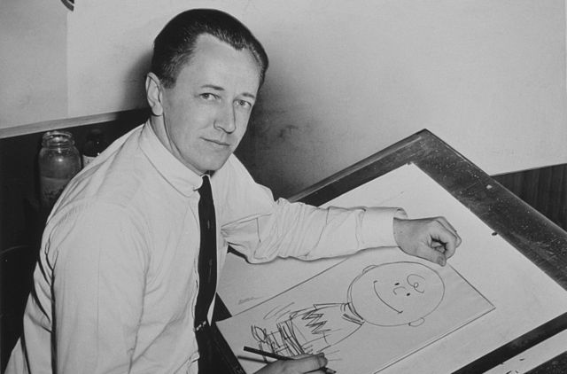 Charles Schulz in 1956 and a Charlie Brown drawing (Photo Roger Higgins, World Telegram staff photographer)