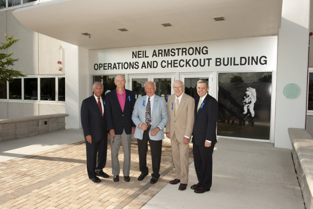 NASA Administrator Charles Bolden, Apollo astronauts Mike Collins, Buzz Aldrin and Jim Lovell, and Center Director Robert Cabana in front of the Neil Armstrong Operations and Checkout Building (Photo NASA/Kevin O’Connell)