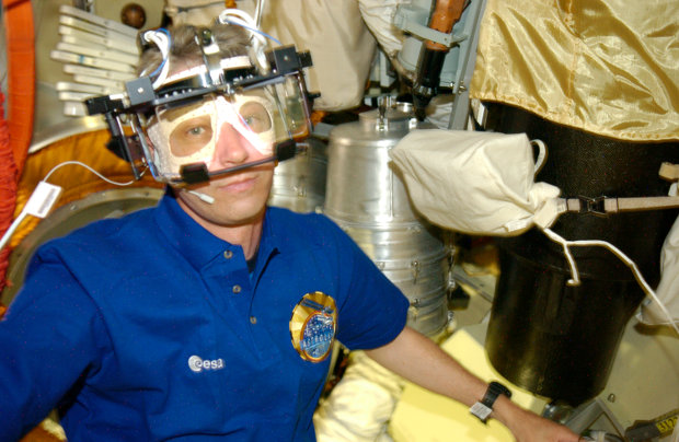 ESA astronaut Thomas Reiter with the Eye Tracking Device (Photo ESA/NASA)