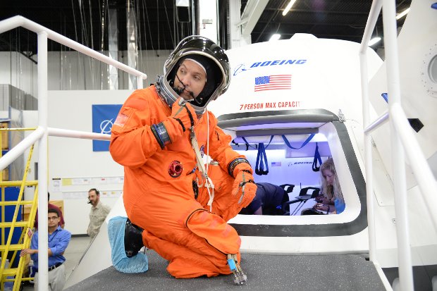Astronaut Randy Bresnik about to enter Boeing CST-100 spacecraft (Photo NASA/Robert Markowitz)